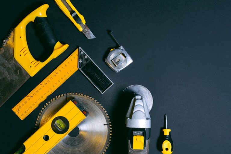 Yellow and Black Hand Tools on the Table